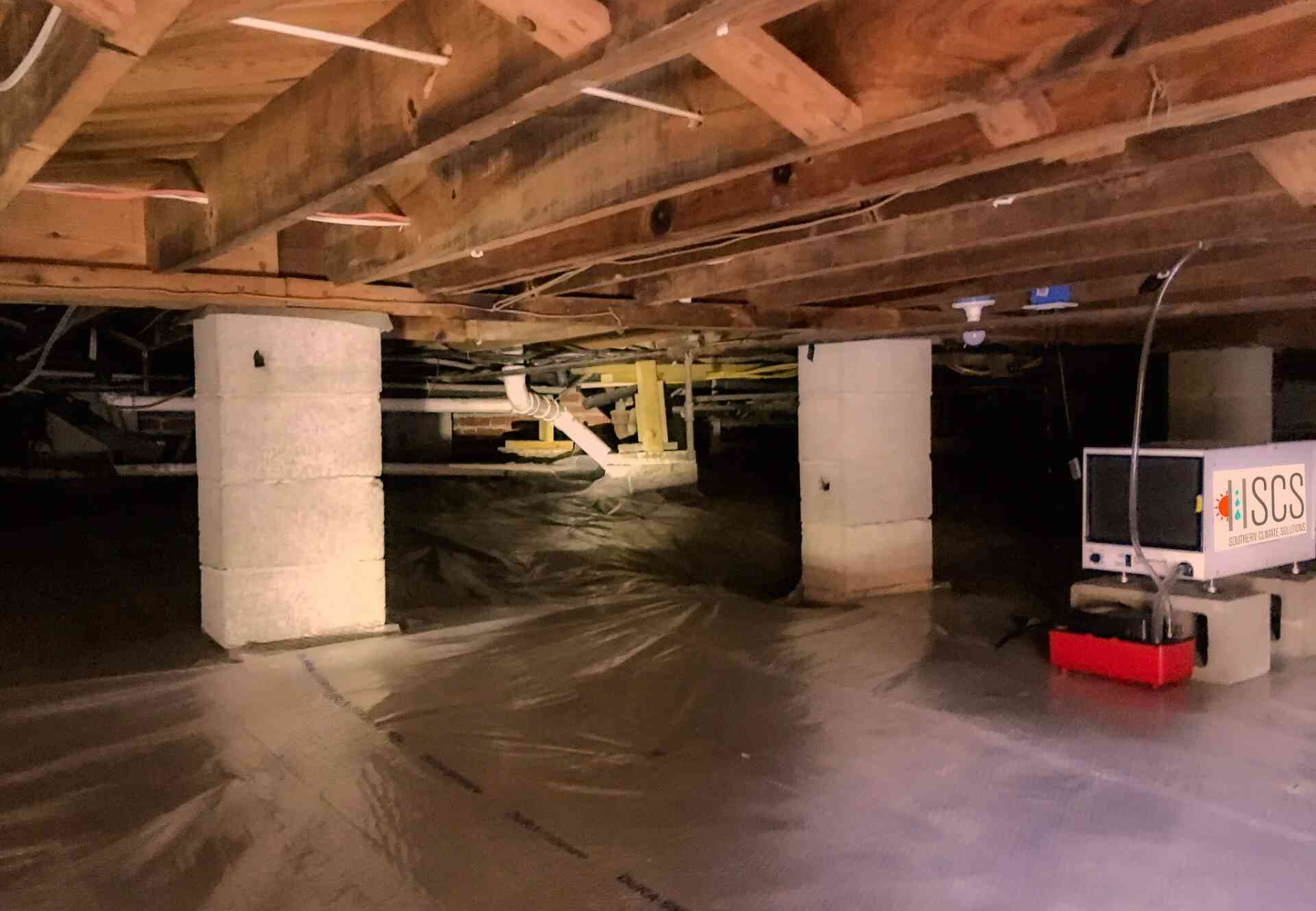 crawl-space Clean crawl space with a bright white vapor barrier and sealed foundation in Pensacola, FL<br />