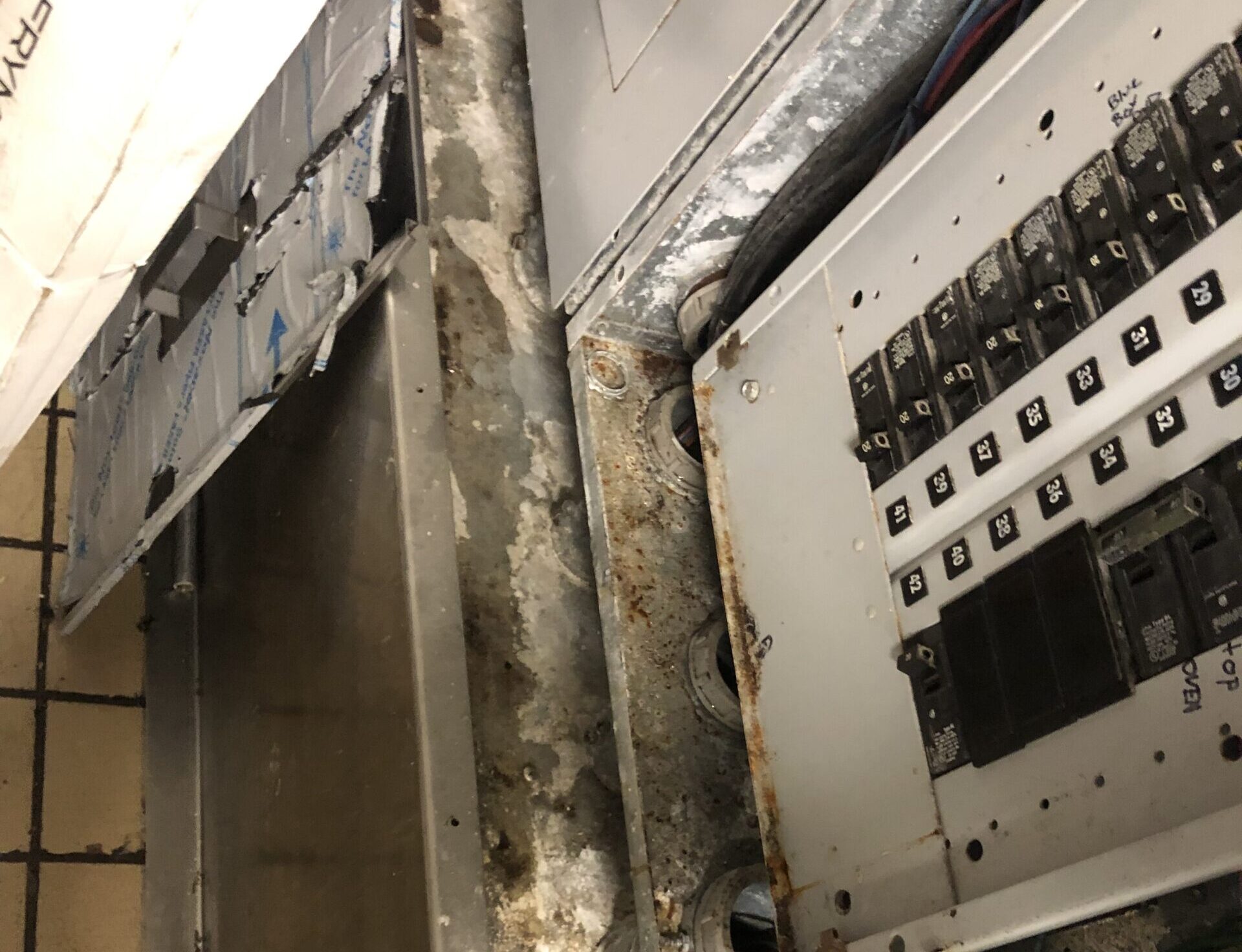 corrosion on electrical panel from high indoor humidity in convenience store